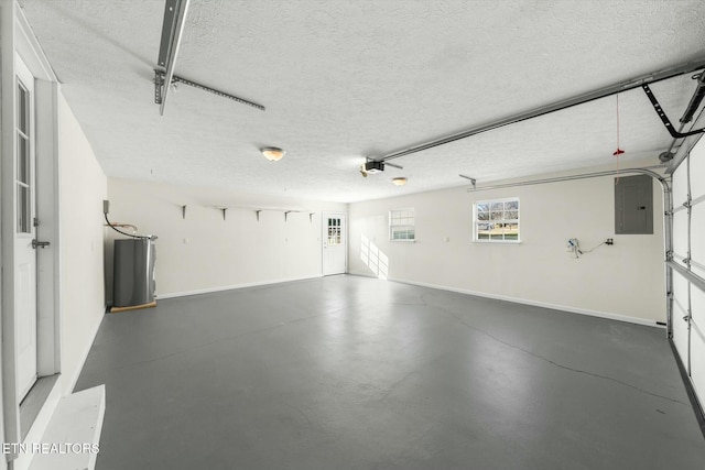 garage featuring a garage door opener and electric panel