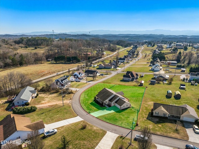 birds eye view of property featuring a mountain view