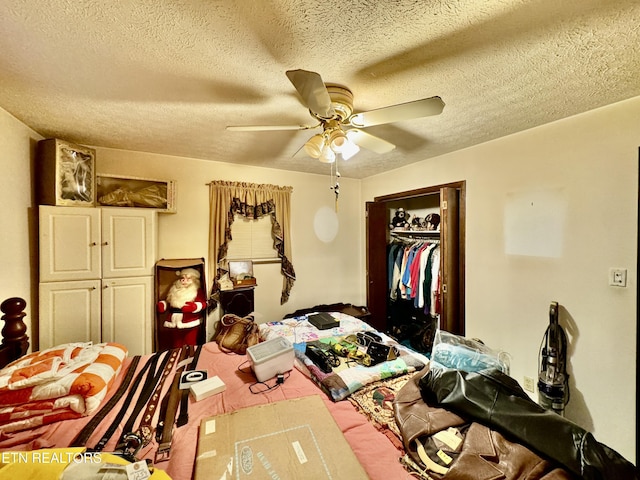 bedroom with a textured ceiling, a closet, and ceiling fan