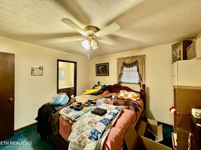 bedroom with ceiling fan, dark carpet, and a textured ceiling