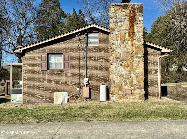 view of side of home featuring central air condition unit