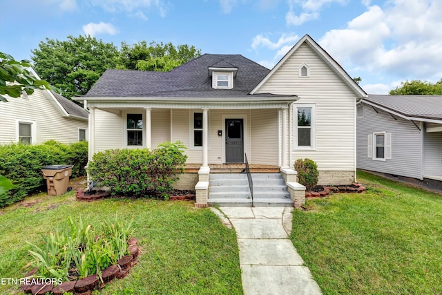 bungalow-style house with a porch and a front yard