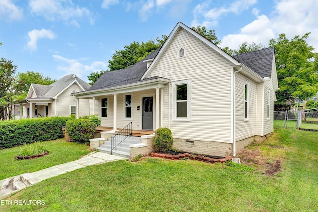 bungalow featuring a front lawn and a porch