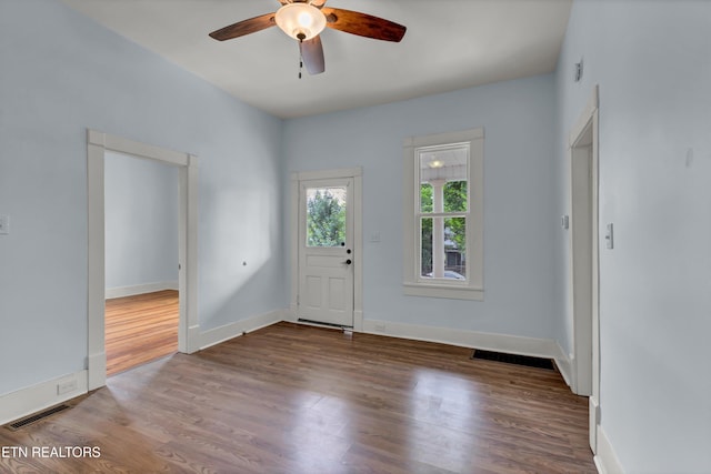 foyer entrance featuring ceiling fan and wood-type flooring