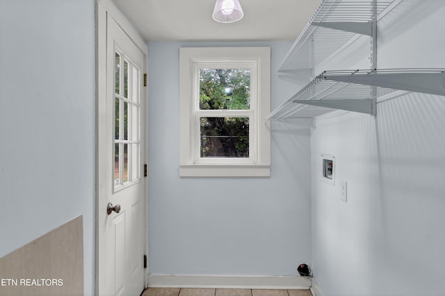 laundry room featuring light tile patterned flooring and hookup for a washing machine