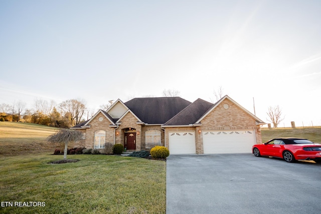 view of front of property featuring a garage and a front lawn