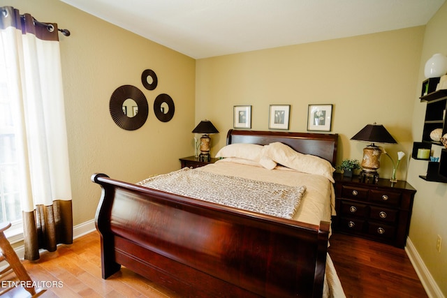 bedroom with wood-type flooring