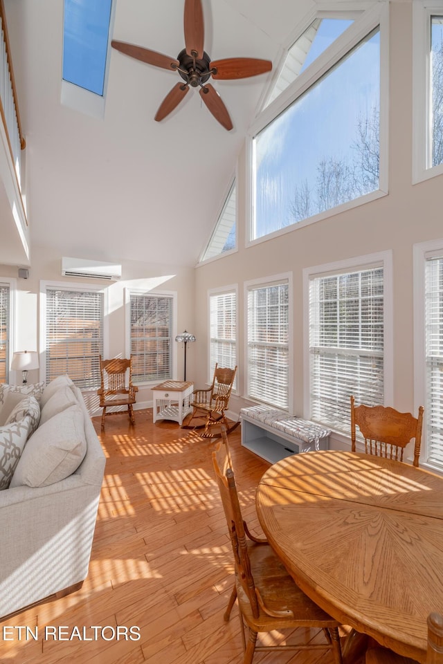 sunroom with ceiling fan and lofted ceiling