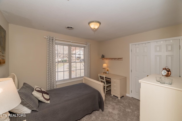 carpeted bedroom featuring a closet