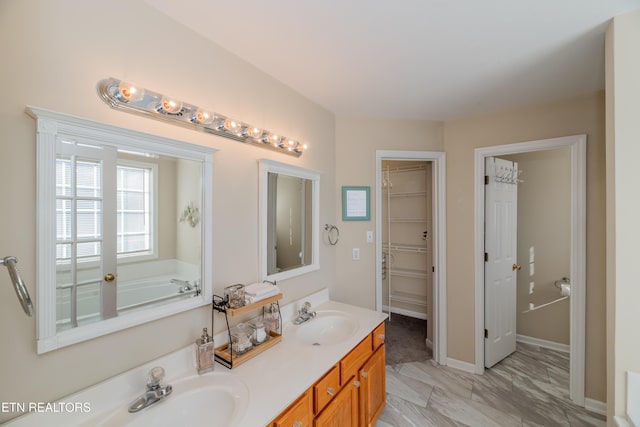 bathroom with a bathing tub and vanity