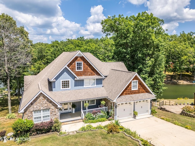 craftsman house featuring a porch and a garage