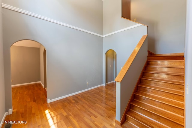 stairs with hardwood / wood-style floors