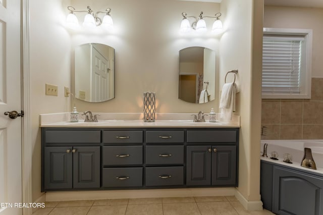 bathroom featuring a tub, tile patterned flooring, and vanity