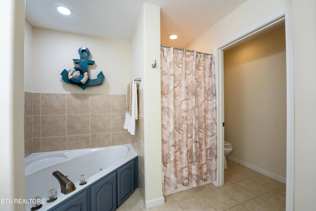 bathroom with tile patterned floors, a bathing tub, and toilet