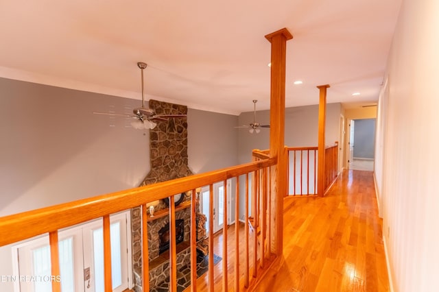 corridor with light hardwood / wood-style flooring