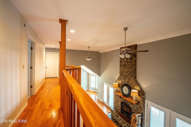 corridor with light hardwood / wood-style flooring