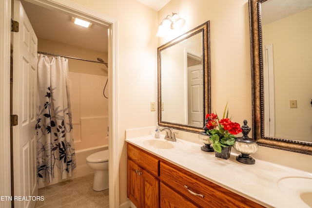 full bathroom featuring tile patterned flooring, vanity, toilet, and shower / tub combo with curtain