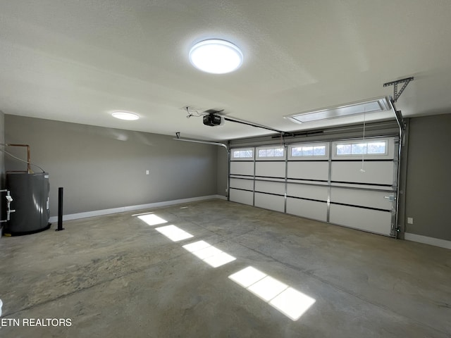 garage with electric water heater and a garage door opener