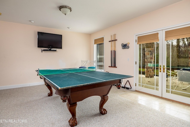 playroom featuring light carpet and french doors