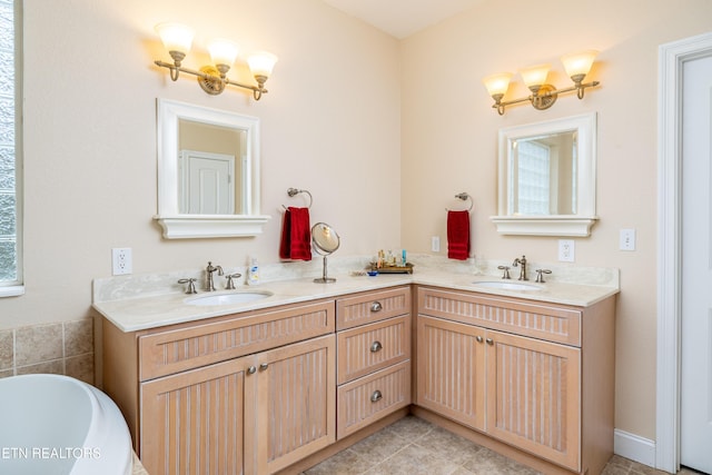 bathroom featuring tile patterned flooring and vanity