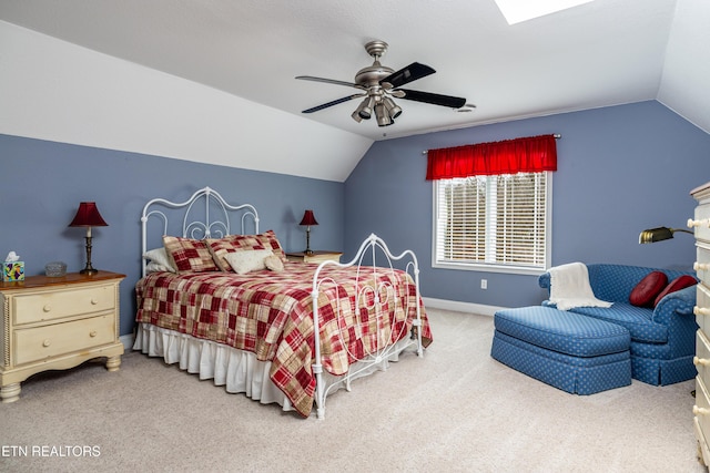 carpeted bedroom featuring ceiling fan and lofted ceiling