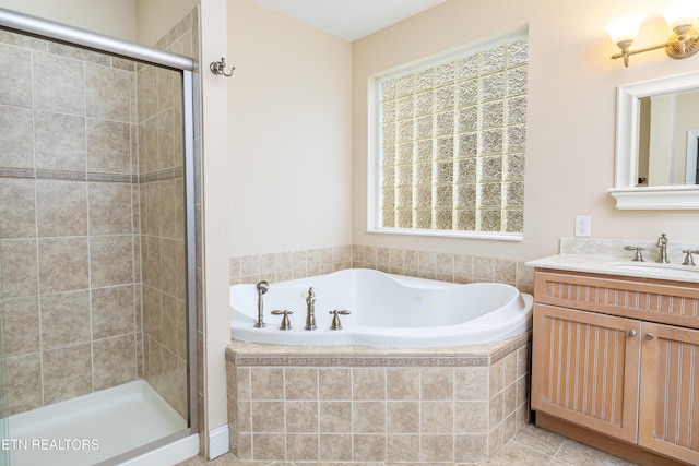 bathroom featuring vanity and shower with separate bathtub