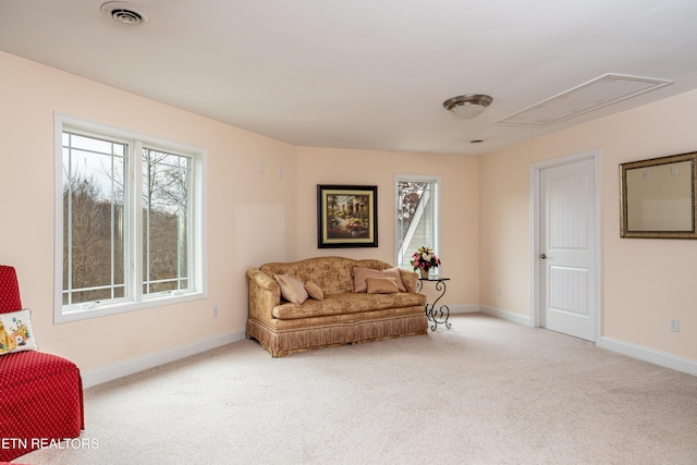 living area with light carpet