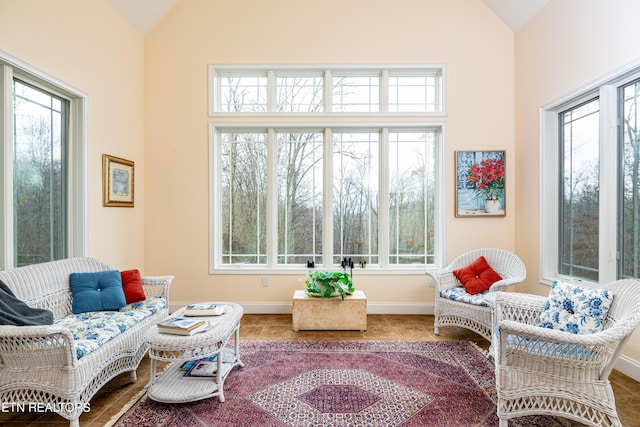 sunroom / solarium featuring lofted ceiling