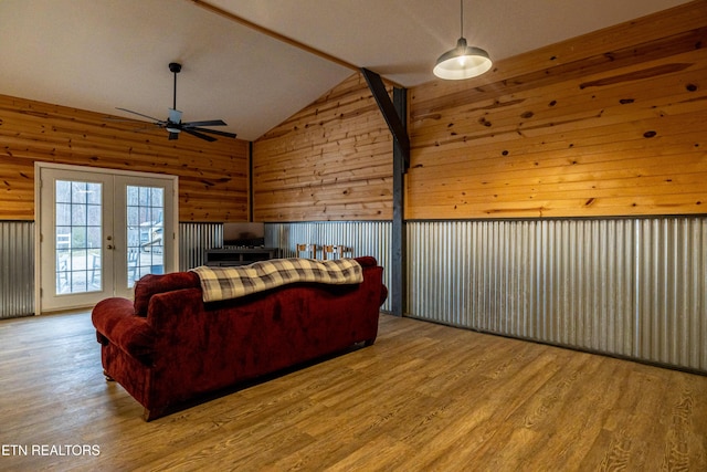 bedroom featuring french doors, access to outside, light hardwood / wood-style flooring, and lofted ceiling