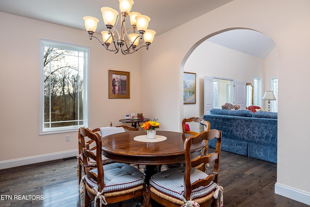 dining room featuring a chandelier and dark hardwood / wood-style floors