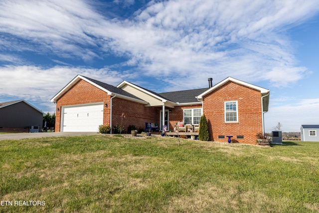 ranch-style home with a front yard and a garage