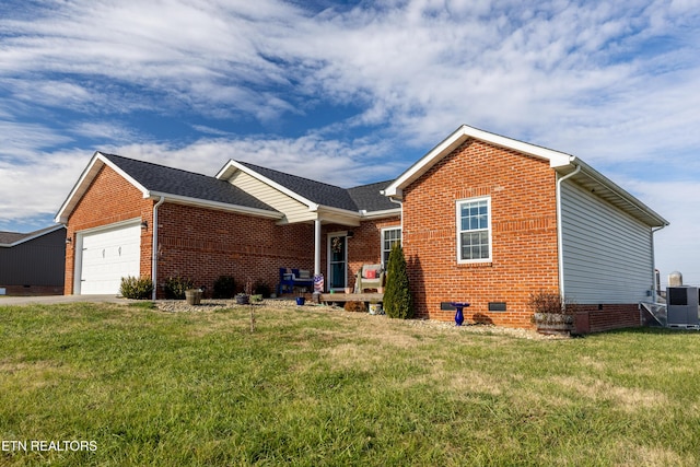 view of front of house with a front yard, a garage, and cooling unit