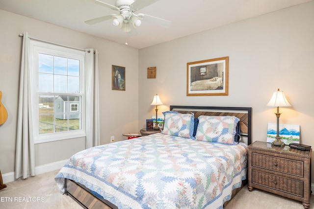 bedroom featuring ceiling fan and light colored carpet