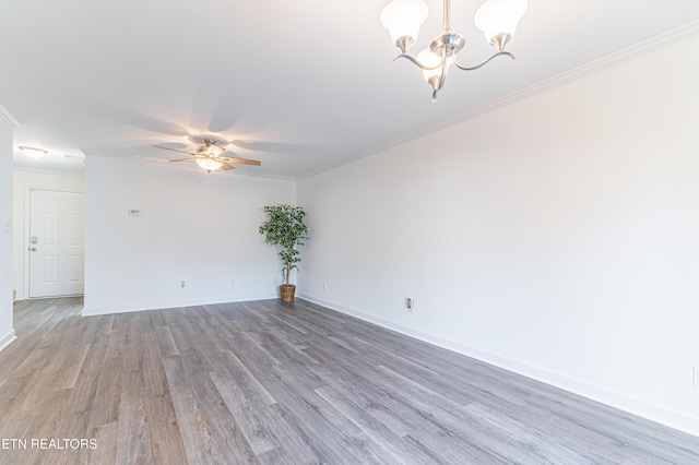 unfurnished room with wood-type flooring, ceiling fan with notable chandelier, and crown molding