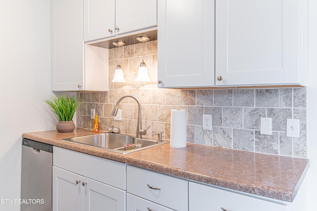 kitchen featuring white cabinets, dishwasher, sink, and backsplash