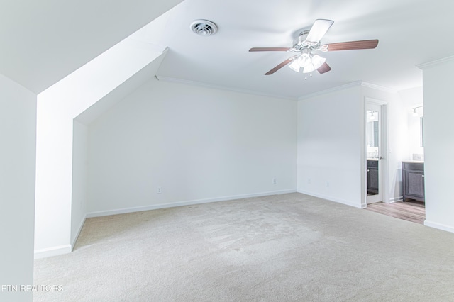 additional living space featuring light carpet and ceiling fan