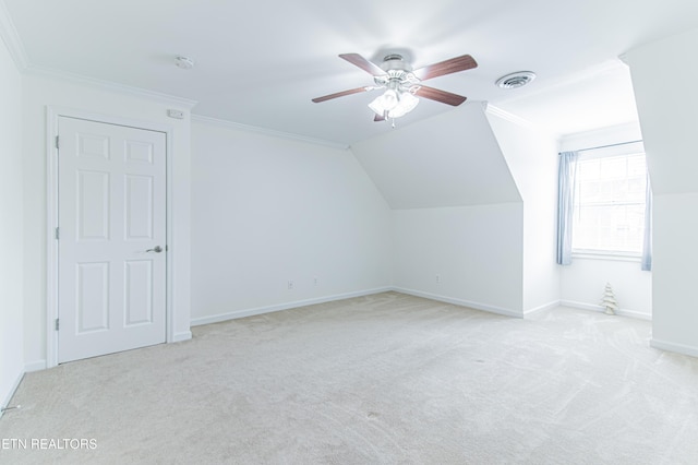 additional living space featuring ceiling fan, light carpet, and vaulted ceiling