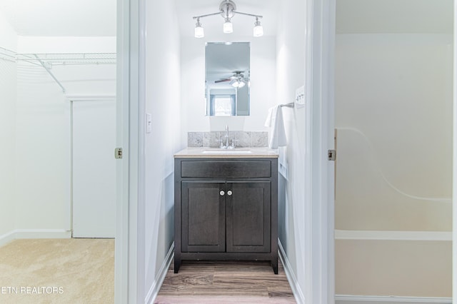 bathroom featuring vanity and ceiling fan