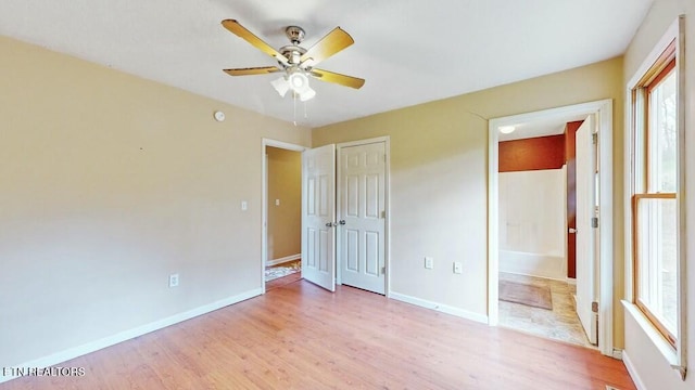 unfurnished bedroom with light hardwood / wood-style flooring and ceiling fan