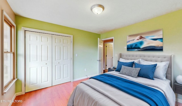 bedroom featuring hardwood / wood-style flooring and a closet