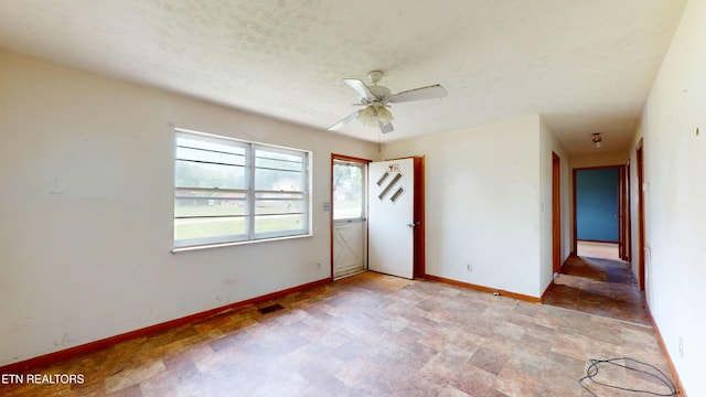 unfurnished room with ceiling fan