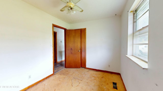 spare room with ceiling fan