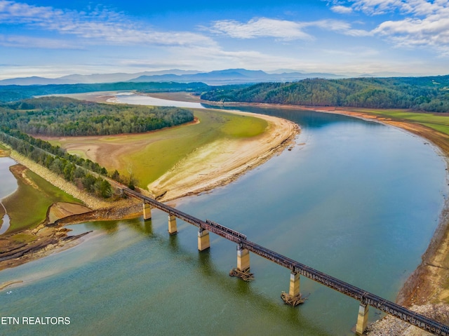 aerial view featuring a water and mountain view