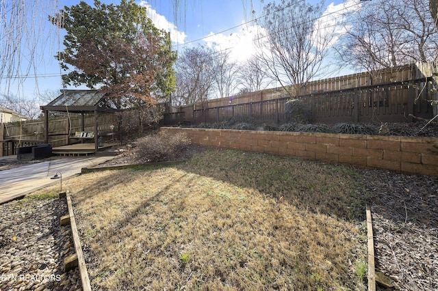 view of yard featuring a wooden deck