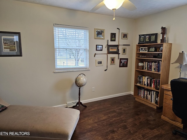 home office featuring wood finished floors, a ceiling fan, and baseboards