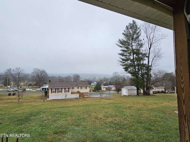 view of yard with a storage shed