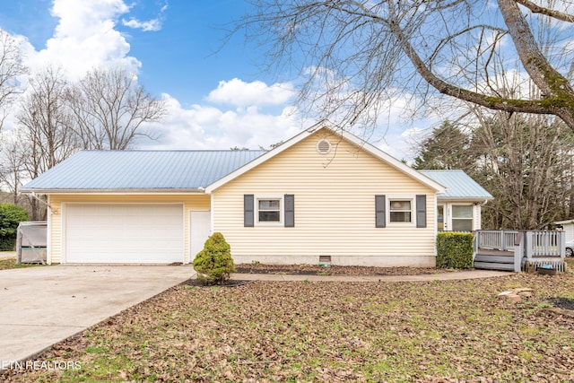 single story home with a garage and a deck