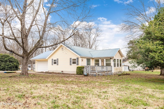 view of front of home featuring a porch, a garage, and a front yard