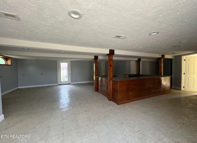 interior space with a textured ceiling