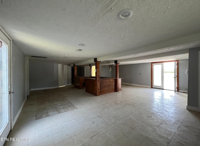 empty room with a textured ceiling